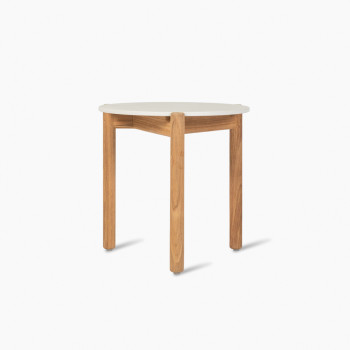 Vincent Sheppard Oda side table with a Portland ceramic top and teak legs.