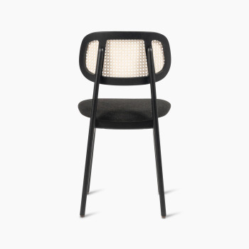 Titus dining chair in black stained oak with a rattan backrest and upholstered seat, rear view.