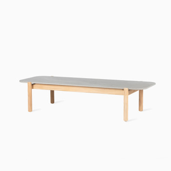 Vincent Sheppard Oda rectangular outdoor coffee table with a flint ceramic top and teak legs.