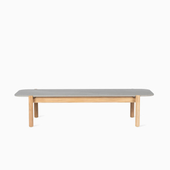 Vincent Sheppard Oda rectangular outdoor coffee table with a flint ceramic top and teak legs.