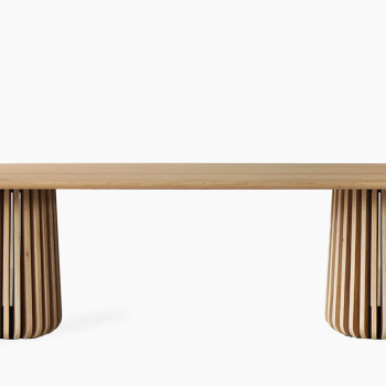 Vincent Sheppard Maru oval dining table with a wooden top and slatted wooden base, featuring a contemporary design.