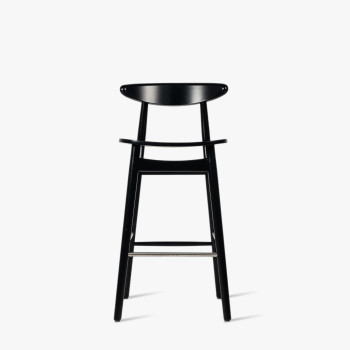  Tabouret de comptoir Vincent Sheppard Teo en noir avec un design épuré et minimaliste et un dossier incurvé.