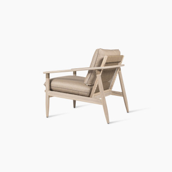 David lounge chair with Savane coconut cushions, viewed from the back at a 135-degree angle, featuring a natural wooden frame, woven backrest, and thick beige cushions.