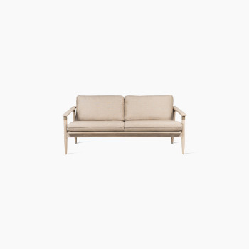 Front view of the David lounge sofa 2-seater by Vincent Sheppard, featuring a natural wooden frame and thick Savane coconut cushions.