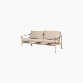 David lounge sofa 2-seater with Savane coconut cushions, viewed at a slight angle, featuring a natural wooden frame and thick beige cushions for comfort.