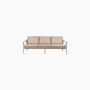 Front view of the David lounge sofa 3-seater by Vincent Sheppard, featuring a natural wooden frame and thick Savane coconut cushions for comfort.