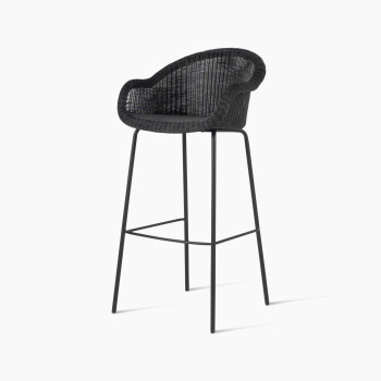 Edgard barstool by Vincent Sheppard, featuring a black wicker seat and steel base, viewed at a 45-degree angle.