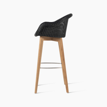 Edgard barstool with an untreated teak base and black Paper Loom wicker seat by Vincent Sheppard, side view.