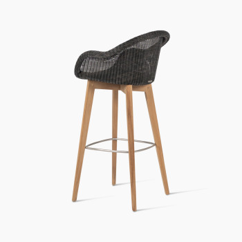 Edgard barstool with a teak base and Mocca-coloured wicker seat by Vincent Sheppard, 135-degree angle view.