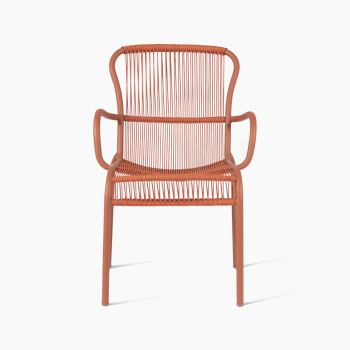 Loop dining chair by Vincent Sheppard, featuring a terracotta-coloured metal frame with woven back and seat design