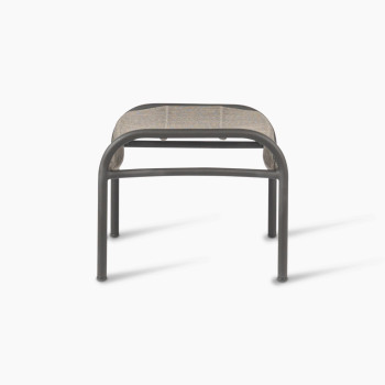 Side view of the Loop footrest in dark grey by Vincent Sheppard, featuring a sleek metal frame and a tightly woven Lloyd Loom surface, designed for foot comfort and style.