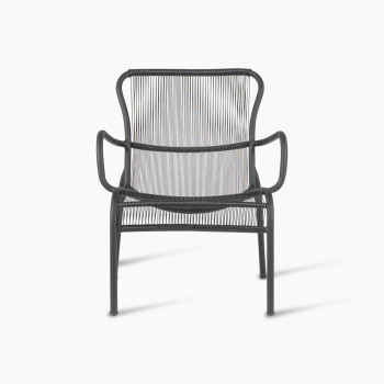 Front view of the Loop lounge chair in black by Vincent Sheppard, featuring a curved metal frame and tightly woven Paper Loom strands for the seat and backrest, offering a modern and comfortable design.