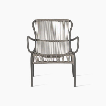 Front view of the Loop lounge chair in fossil grey by Vincent Sheppard, featuring a curved metal frame and tightly woven synthetic rope for the seat and backrest, providing a sleek and contemporary design.