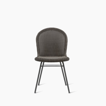 Damien dining chair with a steel A-base and a mocca-coloured synthetic wicker seat.