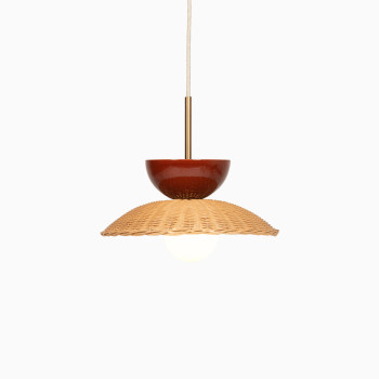 Arvin pendant lamp by Vincent Sheppard featuring maroon ceramic details and a woven rattan shade.