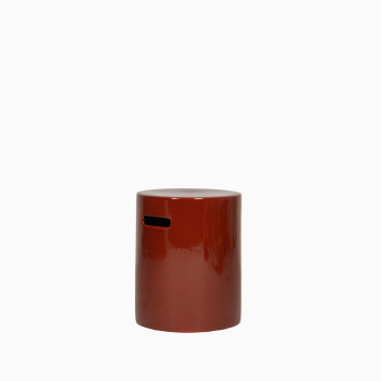 Arvin stool from Vincent Sheppard in maroon, featuring a glossy ceramic finish and a sleek cylindrical design. Can be used as a plant stand, side table, or additional seat.