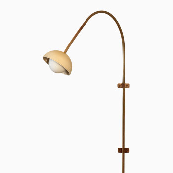 Arvin swivel wall lamp from Vincent Sheppard, featuring a handmade ceramic shade in mushroom colour and a brass swivel tube for a refined, natural look.