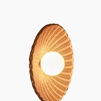 Arvin wall lamp from Vincent Sheppard, featuring a woven rattan shade and a brass fixture for a warm, natural look.